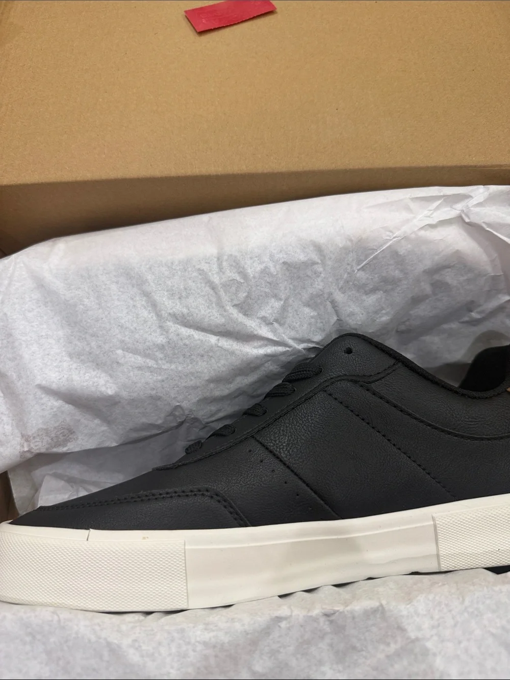 Levi's Men's Black Sneakers with Brown Heel Accent and White Sole